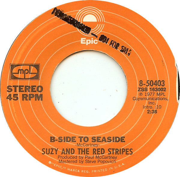 Suzy And The Red Stripes : Seaside Woman (7", Single)