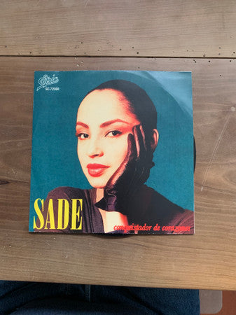 Sade : Conquistador De Corazones = Smooth Operator / Cuidado Con El Amor = Hang On To Your Love (7", Single)