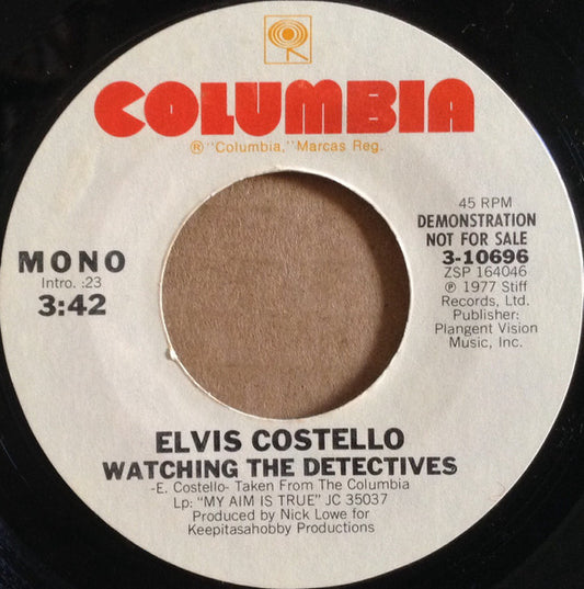 Elvis Costello : Watching The Detectives (7", Single, Mono, Promo, Styrene, Ter)