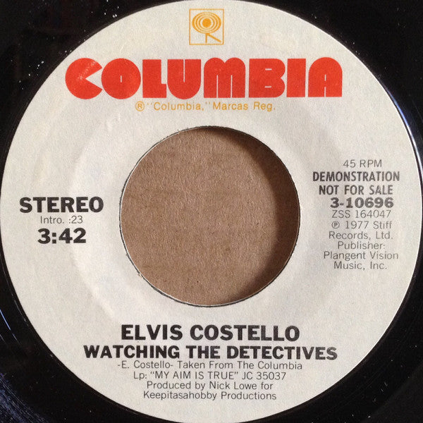 Elvis Costello : Watching The Detectives (7", Single, Mono, Promo, Styrene, Ter)